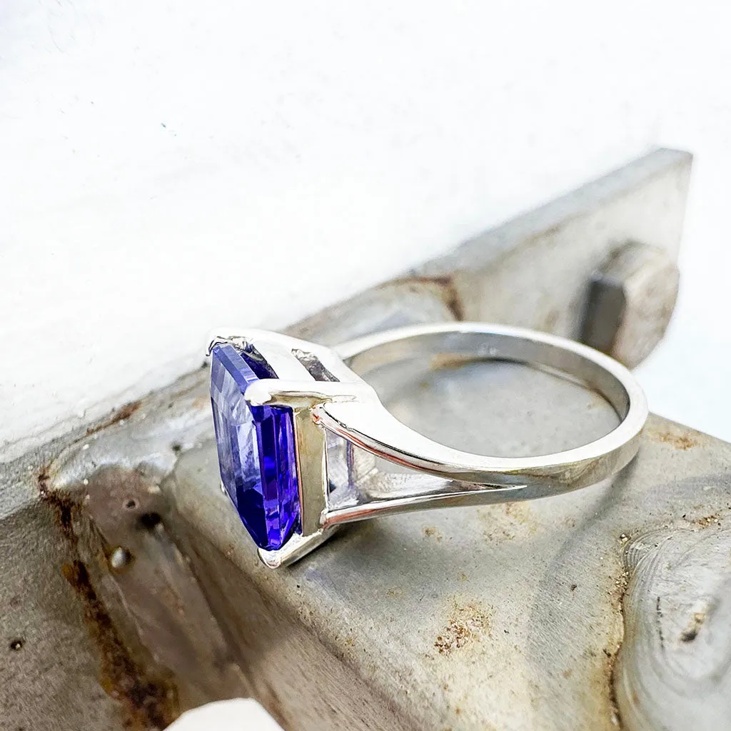 Regal Elevated Emerald Cut Tanzanite Solitaire White Gold Ring