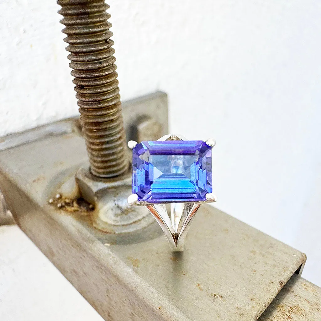 Regal Elevated Emerald Cut Tanzanite Solitaire White Gold Ring