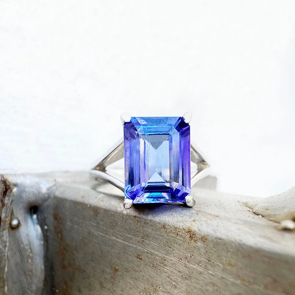 Regal Elevated Emerald Cut Tanzanite Solitaire White Gold Ring