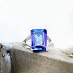 Regal Elevated Emerald Cut Tanzanite Solitaire White Gold Ring